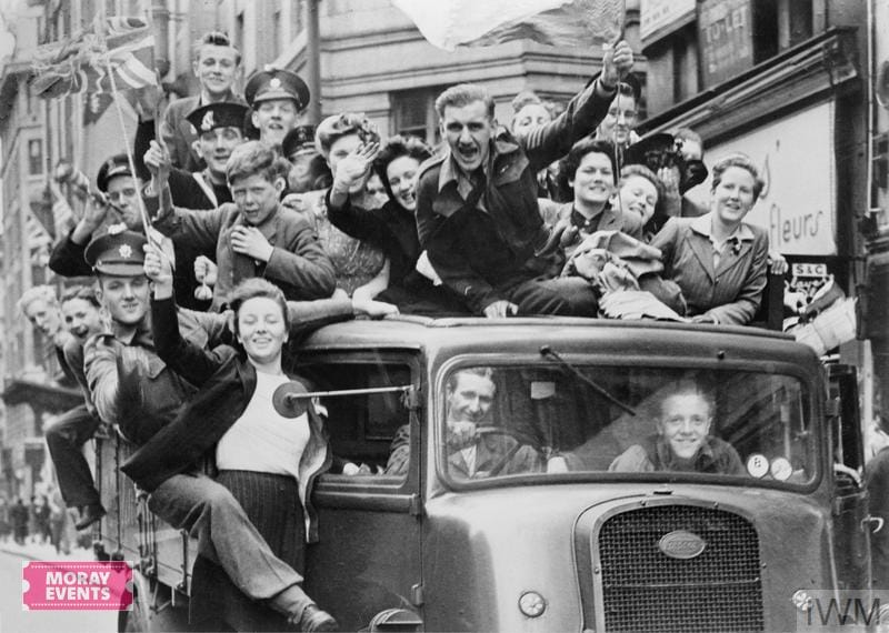 Celebrating a historic parade with joyful crowds and vintage vehicles, showcasing community spirit and festive event atmosphere at Moray Events.