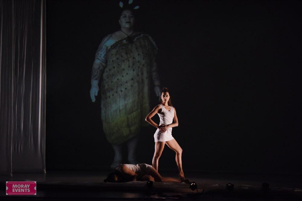 Elegant dance performance on stage at Moray Events, showcasing artistic expression and entertainment in Moray, Scotland. Beautiful choreography and striking visuals highlight local event capabilities.