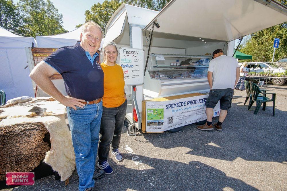 Delicious local ice cream at Moray Events food stall in Moray, Scotland, with happy vendors and customers enjoying outdoor market atmosphere.